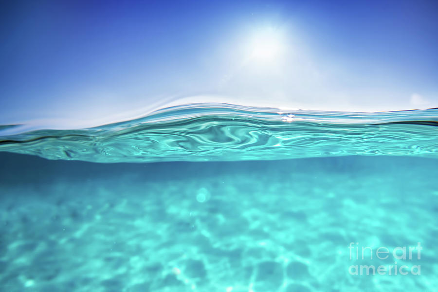 Half underwater shot, clear water and sunny blue sky. Tropical ocean Photograph by Michal Bednarek
