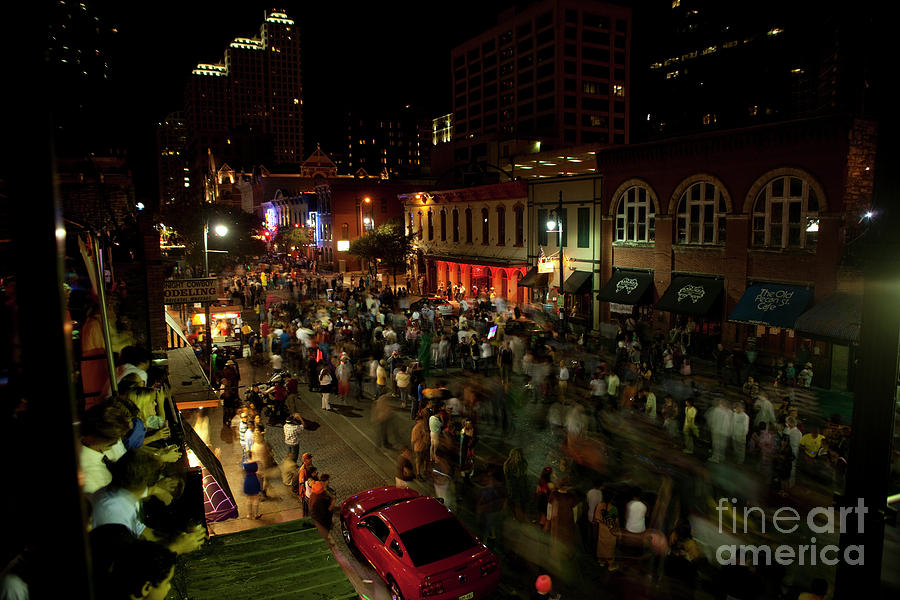 Halloween Photograph - Halloween is a sacred tradition on 6th Street in downtown Austin by Dan Herron