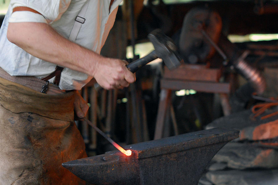 Hammer the iron Photograph by Greg Straub - Fine Art America