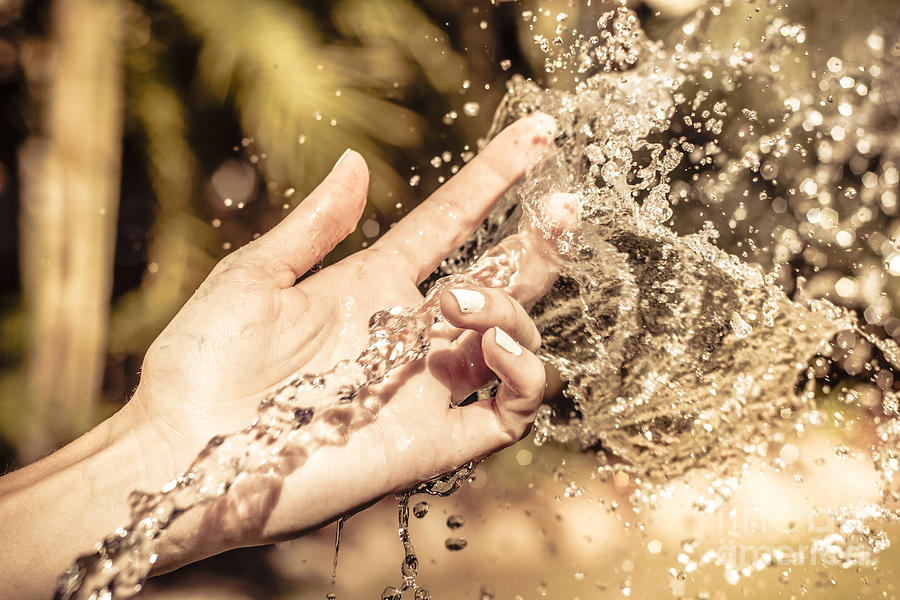 Hand of a woman catching water stream Photograph by Jorgo Photography