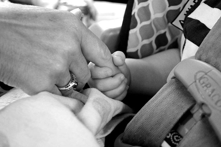 Holding Hands Photograph - Hand of love by Carissa Kreuziger