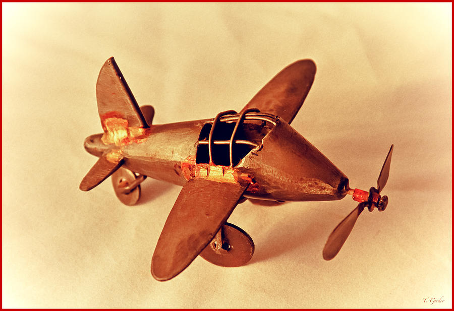 Vintage Photograph - Handmade Metal Toy Plane by Tony Grider