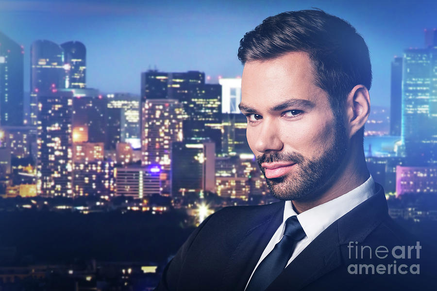 Handsome man on city at night background. Photograph by Michal Bednarek