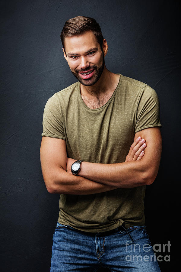 Handsome man smiling, standing confident with crossed arms Photograph by Michal Bednarek
