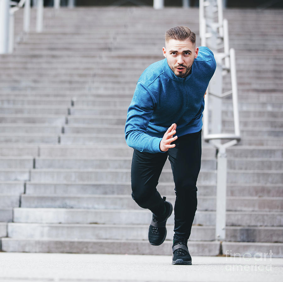 Handsome sportsman running in athletic clothes Photograph by Michal Bednarek