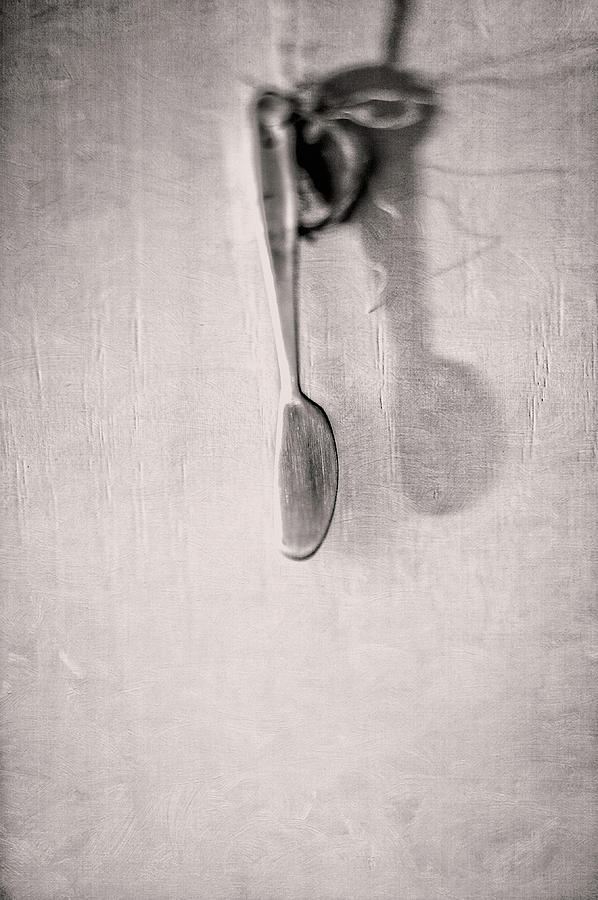 Hanging Knife On Jute Twine In Bw Photograph
