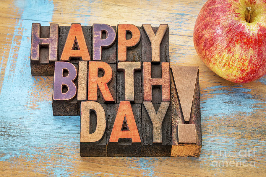 Happy Birthday in wood type with apple Photograph by Marek Uliasz