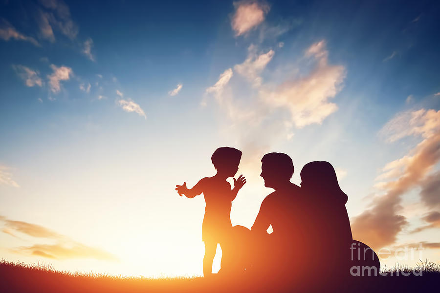 Happy family together at sunset. Photograph by Michal Bednarek