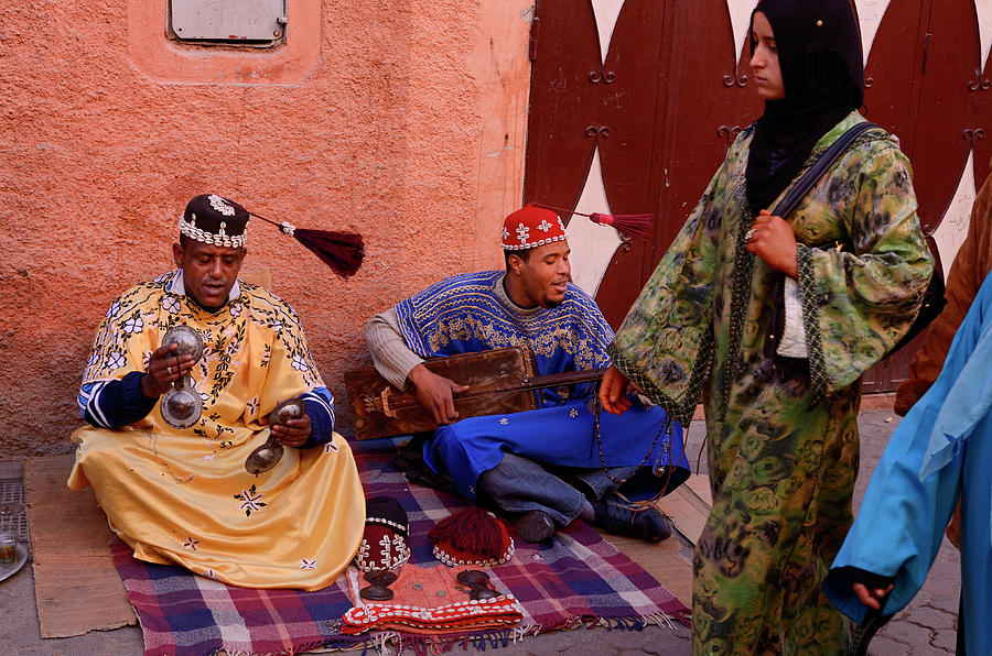 Musician Photograph - Happy Gnawa street musicians in Marrakech swinging their tarboos by Reimar Gaertner