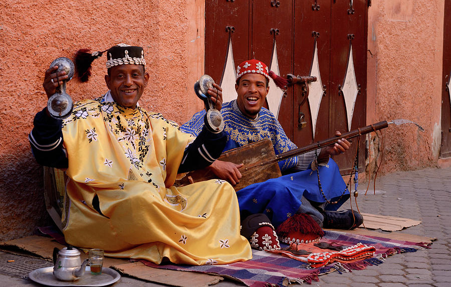 Happy Gnawa street musicians playing and singing in Marrakech wi Photograph by Reimar Gaertner