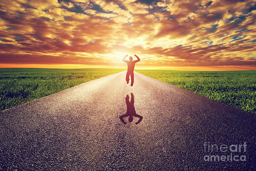 Sunset Photograph - Happy man jumping on long straight road towards sunset sun by Michal Bednarek