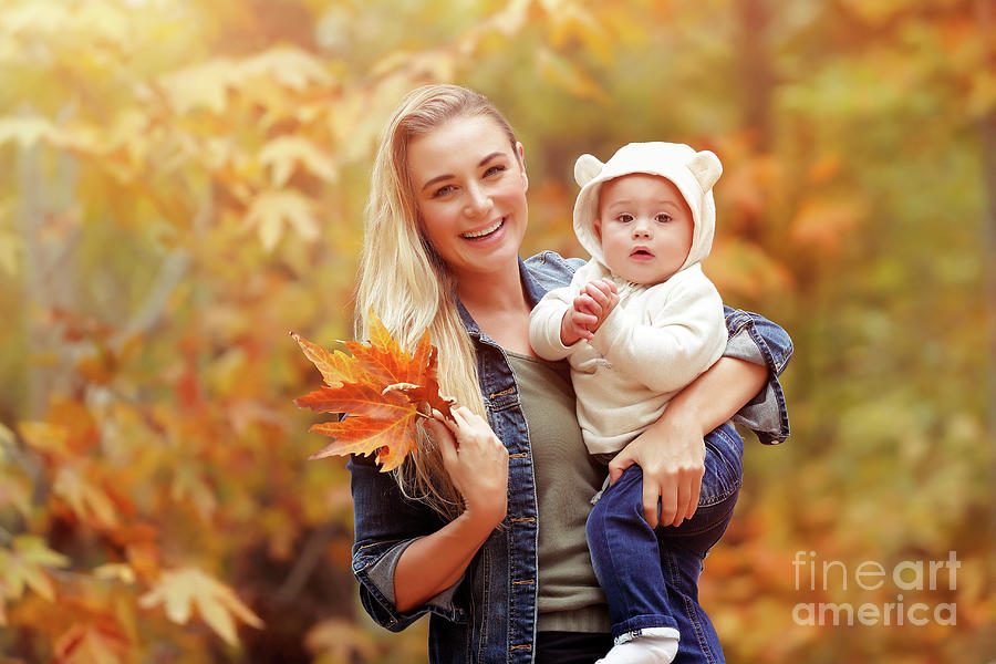 Happy mother with baby in autumn park Photograph by Anna Om