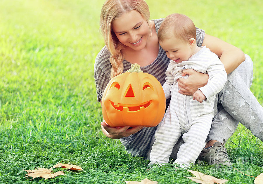 Happy mother with baby in Halloween holiday Photograph by Anna Om