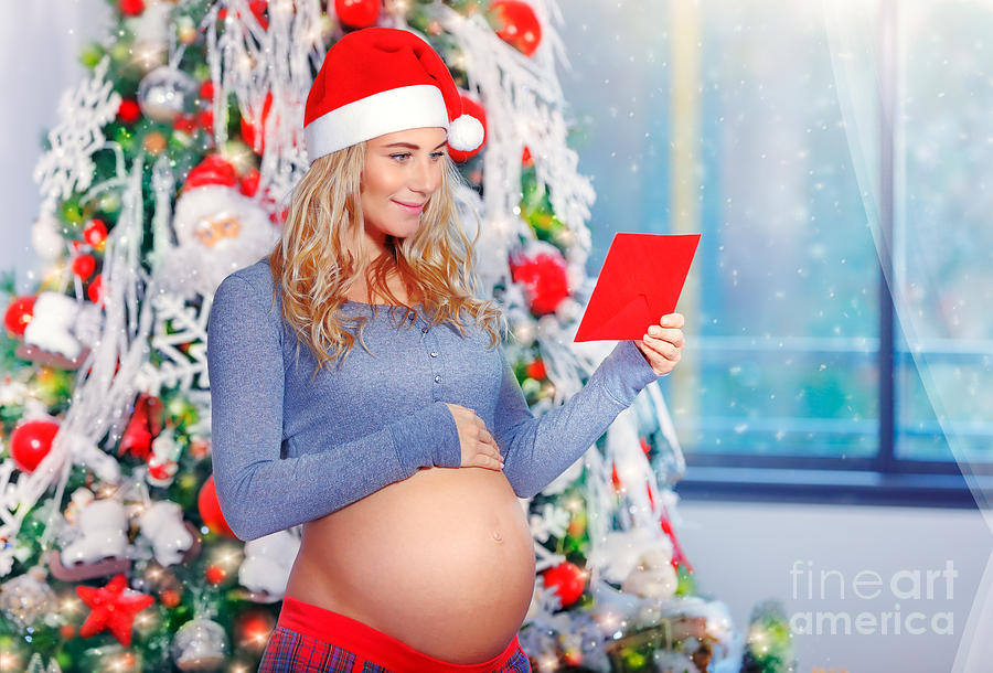 Happy pregnant woman in Christmas eve Photograph by Anna Om