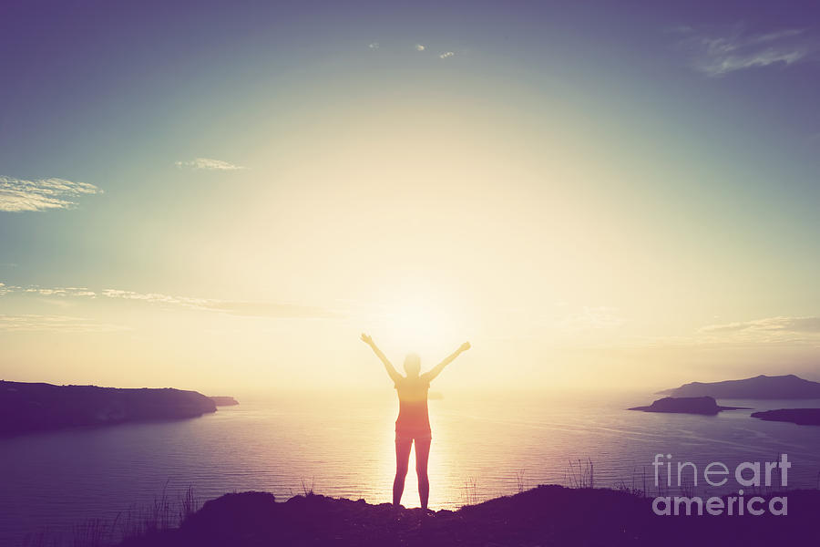 Happy woman with hands up on cliff over sea and islands at sunset Photograph by Michal Bednarek