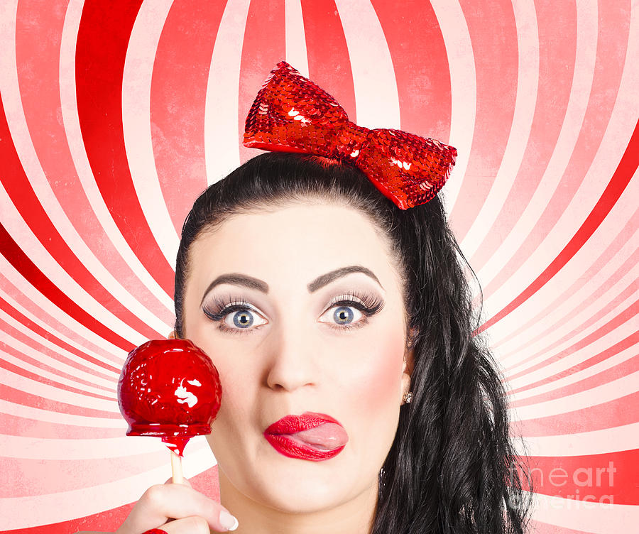 Happy young retro woman with lollipop toffee apple Photograph by Jorgo Photography