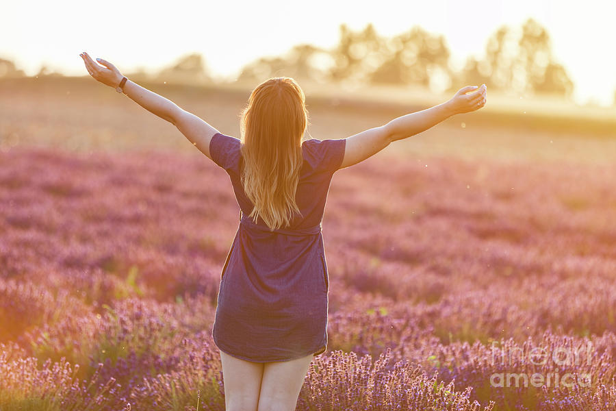 Happy young woman on lavender field at sunset Photograph by Michal Bednarek