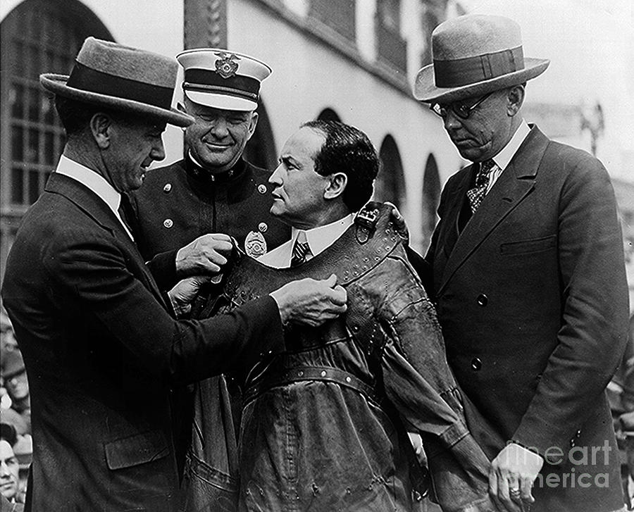 Magic Photograph - Harry Houdini being fitted into a straitjacket by American School