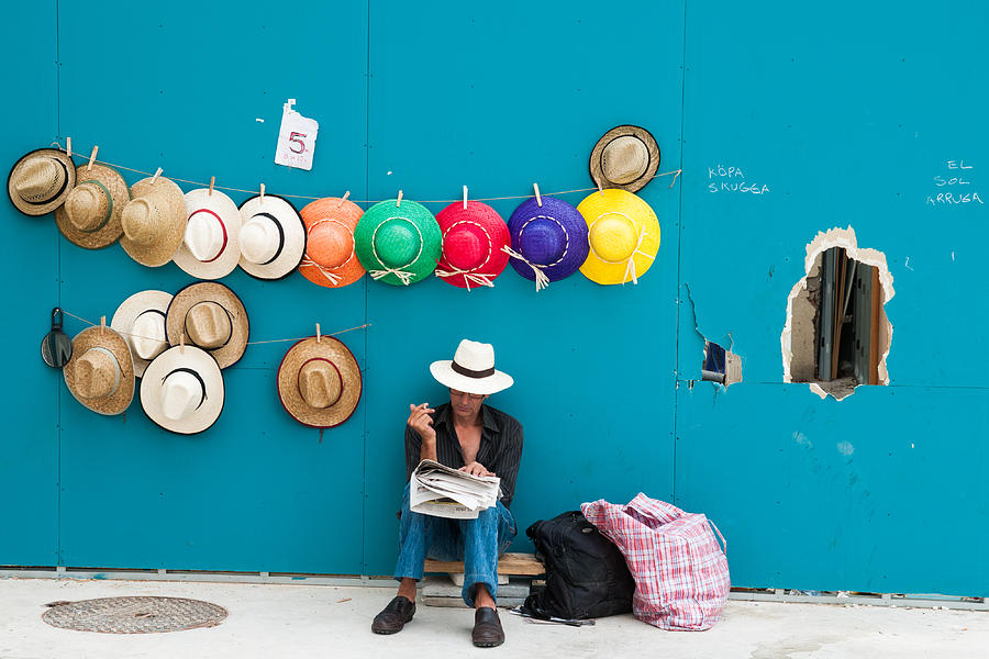 Hat Photograph - Hat seller with colorfull hats Barcelona Spain by Matthias Hauser