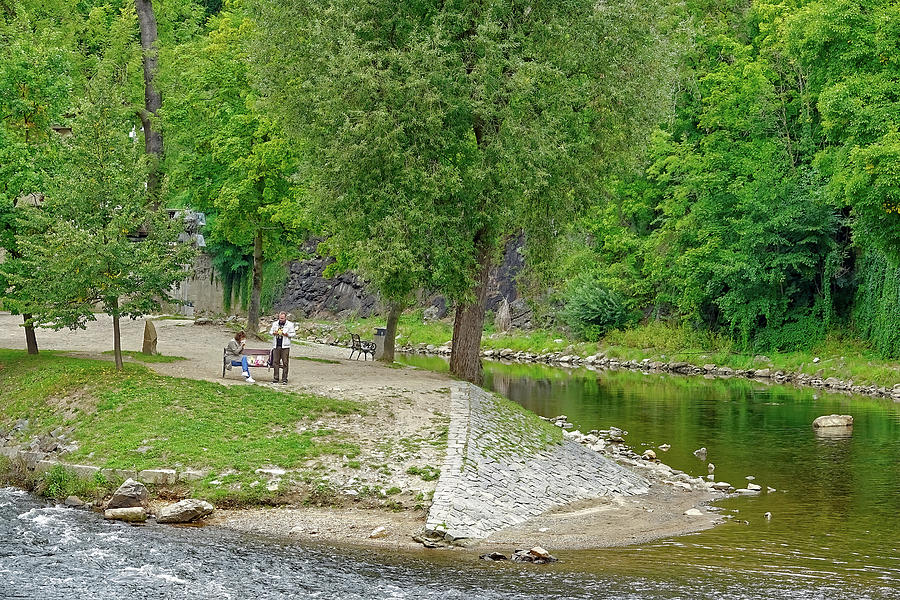 Having A Picnic Lunch By The Banks Of The Vltava River In Cesky Krumlov Photograph by Rick Rosenshein