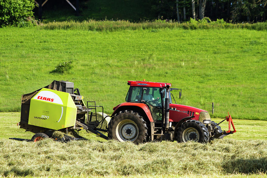 Hay baling in Jura mountains - France Photograph by Paul MAURICE