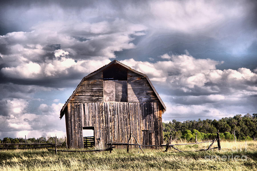 Hay barn with clouds in Colorado Photograph by Jeff Swan