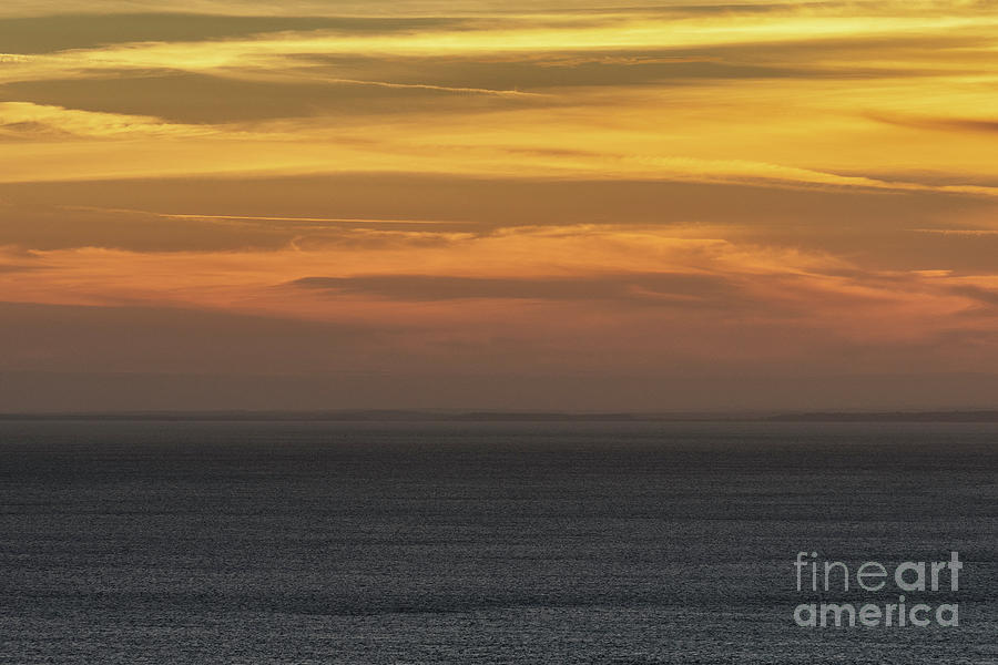 Hazy sunset over the sea Photograph by Clayton Bastiani