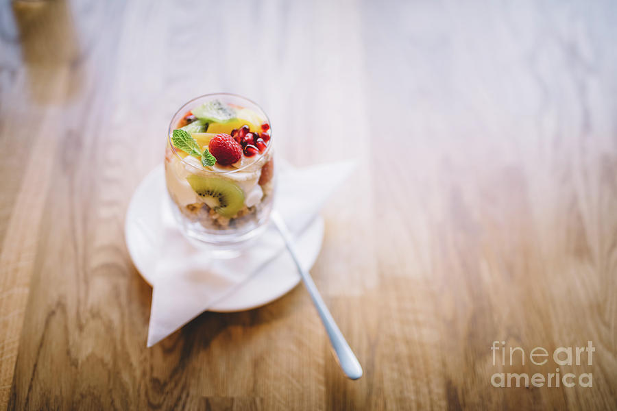 Healthy dessert in a glass on a wooden table Photograph by Michal Bednarek