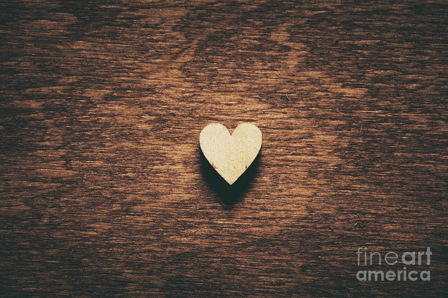 Heart on dark wooden background Photograph by Michal Bednarek
