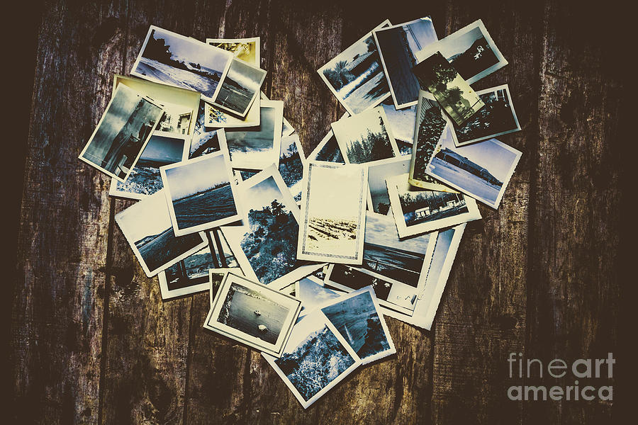 Heart-shaped instant photographs on wooden background Photograph by Jorgo Photography