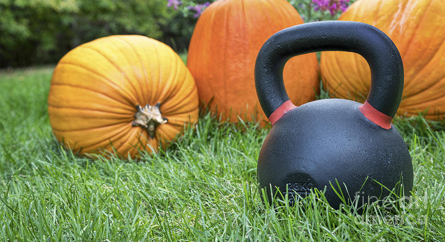 Heavy Kettlebell And Pumpkins Photograph by Marek Uliasz