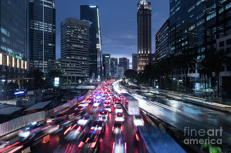 Heavy traffic rushing along the Sudirman avenue in the heart of Jakarta business district  Photograph by Didier Marti