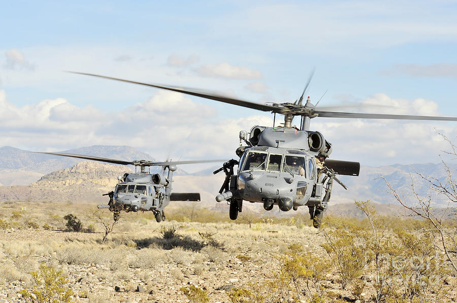 Hh-60g Pave Hawk Helicopters Land Photograph by Stocktrek Images