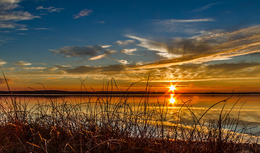Higgins Lake sunset with saw grass Photograph by Joe Holley