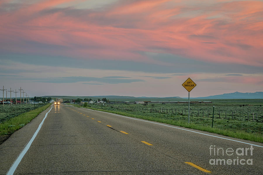highway at dusk in Colorado Photograph by Marek Uliasz