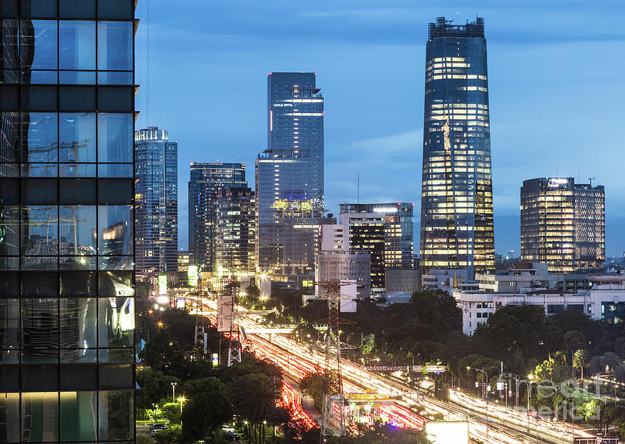 Highway in Jakarta business district at night in Indonesia Photograph by Didier Marti
