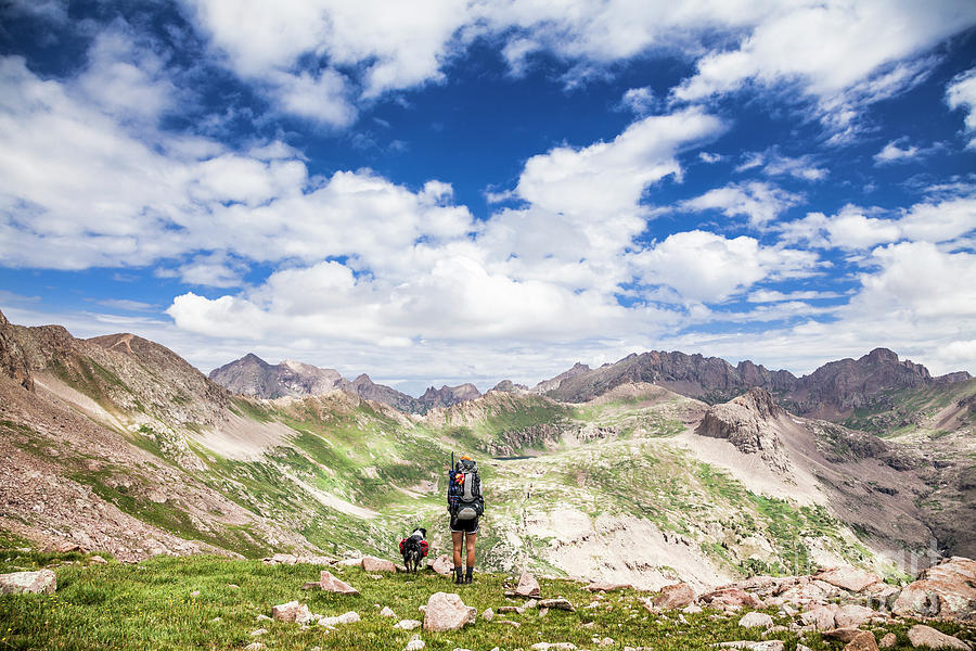 Hiker and dog Photograph by Olivier Steiner