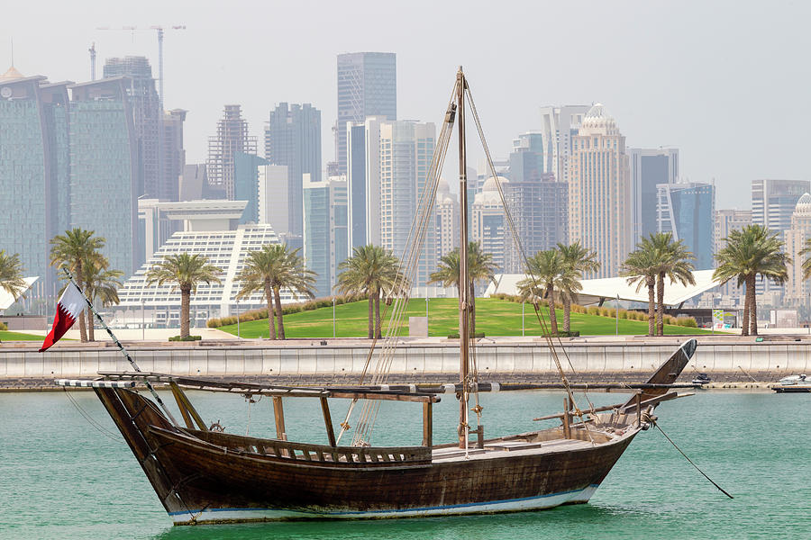 Historic dhow and towers Photograph by Paul Cowan