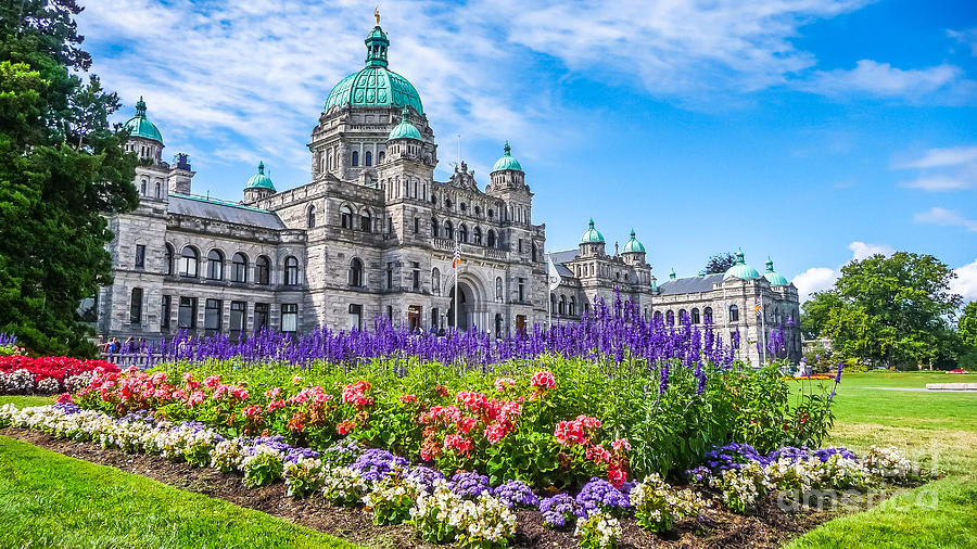 Historic parliament building in Victoria with colorful flowers, BC, Canada Photograph by JR Photography