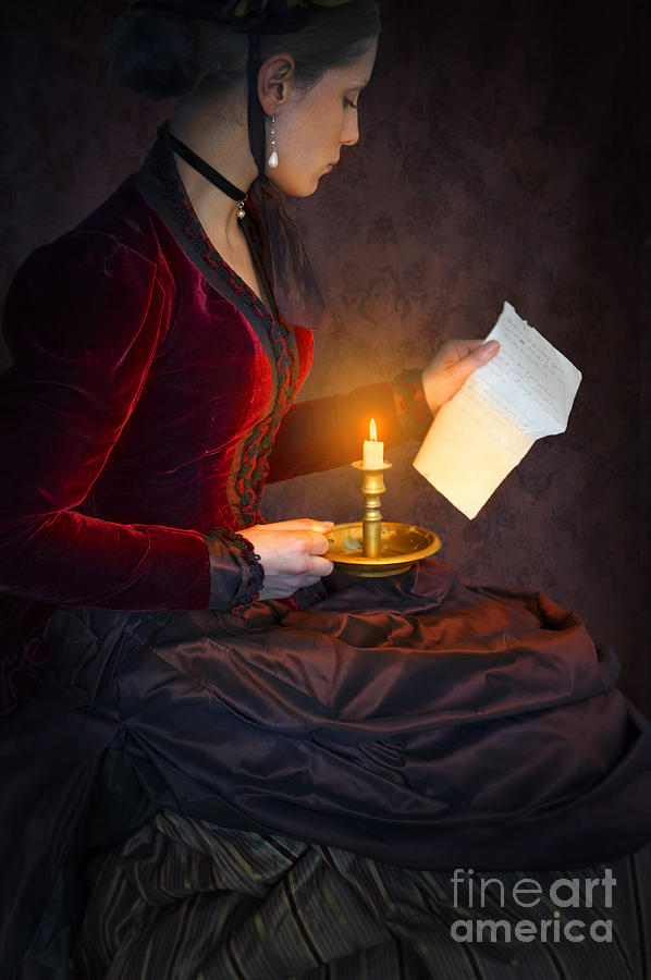 Historical Victorian Woman Reading A Letter By Candlelight Photograph by Lee Avison
