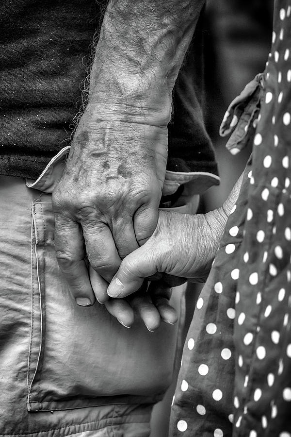 Black And White Photograph - Holding Hands at Any Age by John Haldane