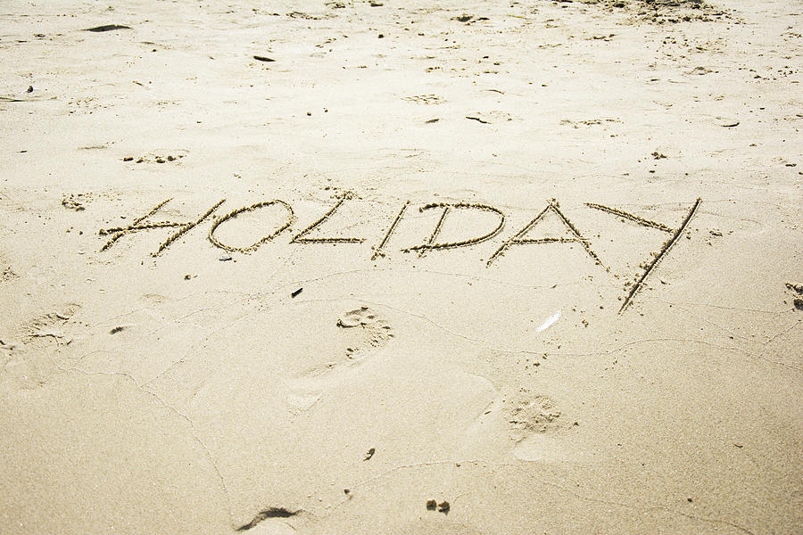 Holiday Word Written In Sand Photograph