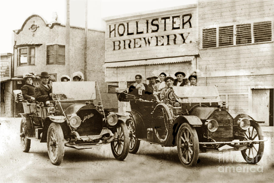 Car Photograph - Hollister Brewery on San Benito St. with two cars by Monterey County Historical Society