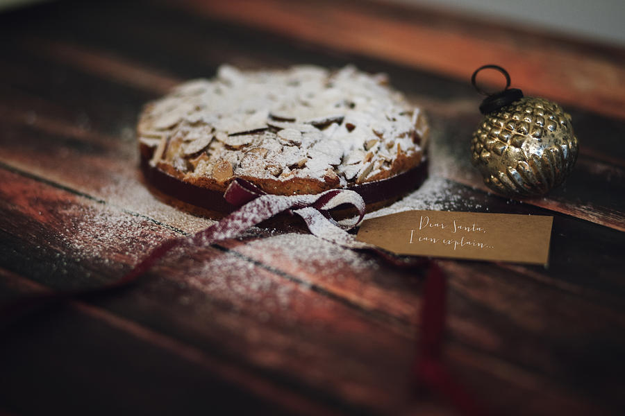 Cake Photograph - Home made almond cake with Christmas decorations by Aldona Pivoriene