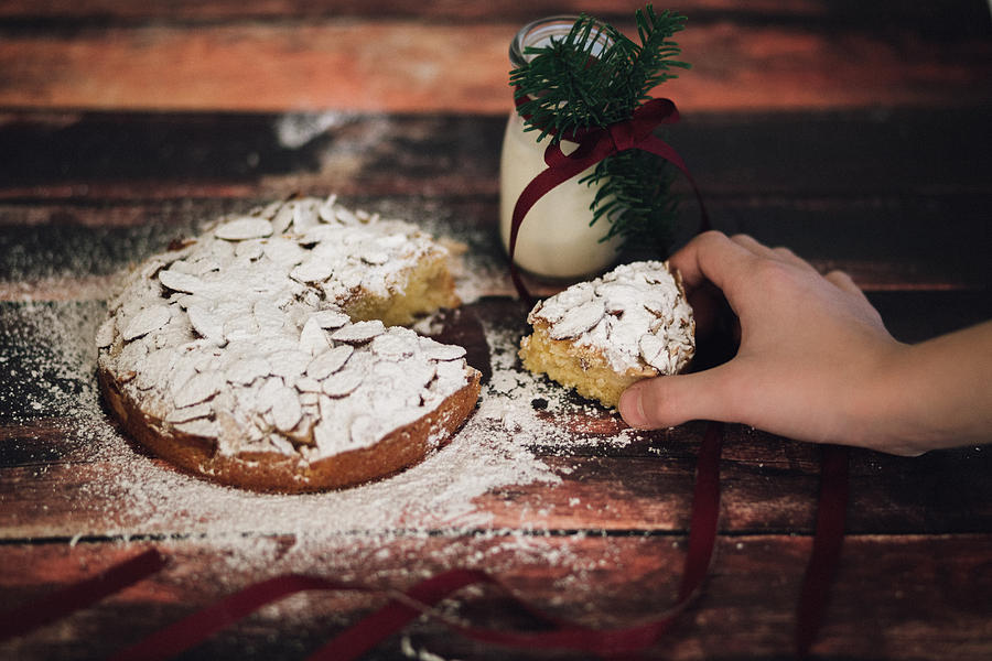 Cake Photograph - Home made almond cake with Christmas decorations and a bottle of milk by Aldona Pivoriene