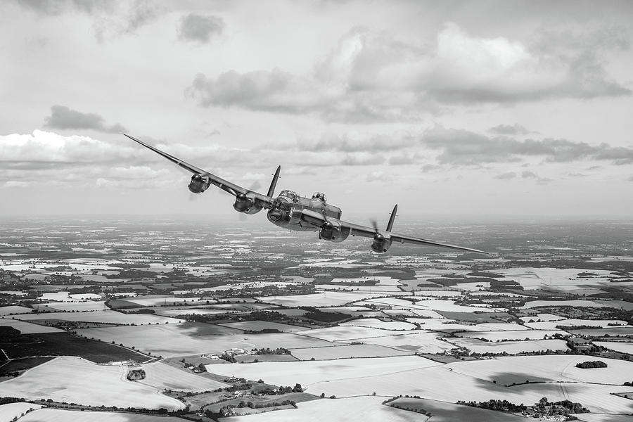 Home stretch Lancaster over England BW version Photograph by Gary Eason