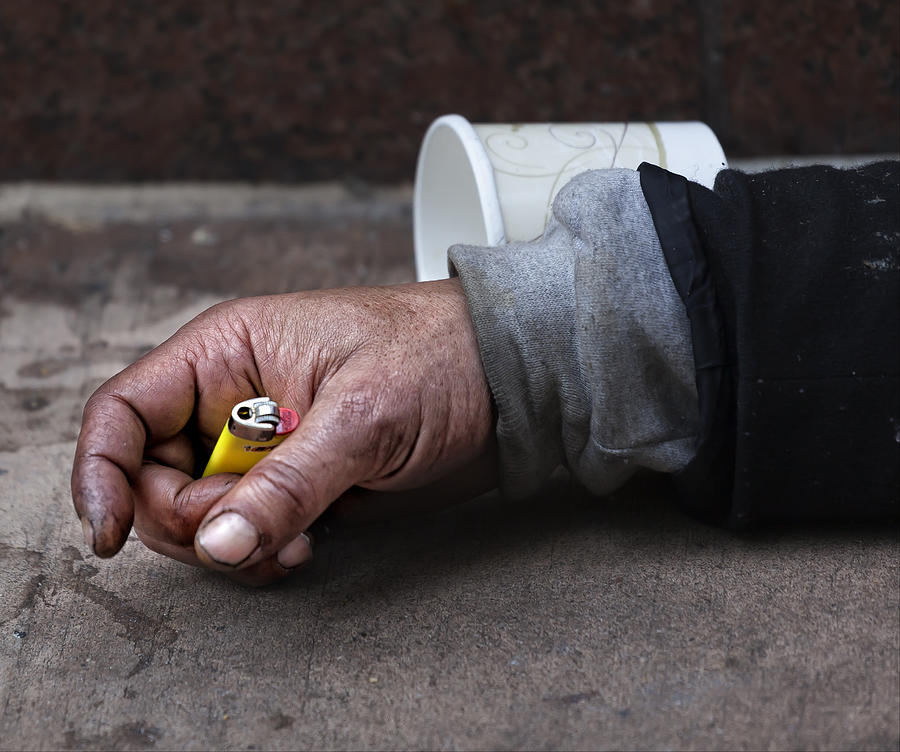 Homeless Hand Holding Lighter Photograph by Robert Ullmann