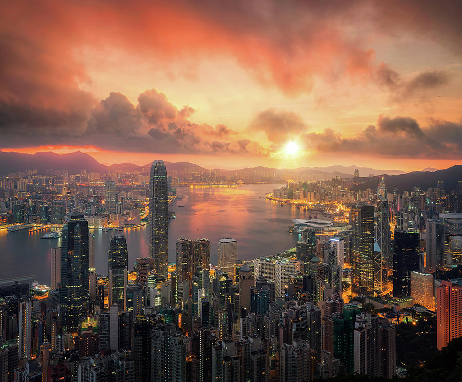 Hongkong city scape with sun and light from building Photograph by Anek Suwannaphoom