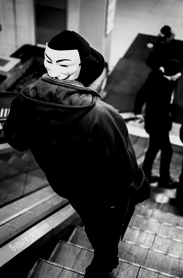 Hooded Youth Wearing a Vendetta Mask Photograph by John Williams