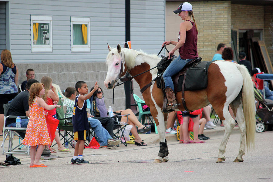Horse Petting Kid at Parade Photograph by Brook Burling